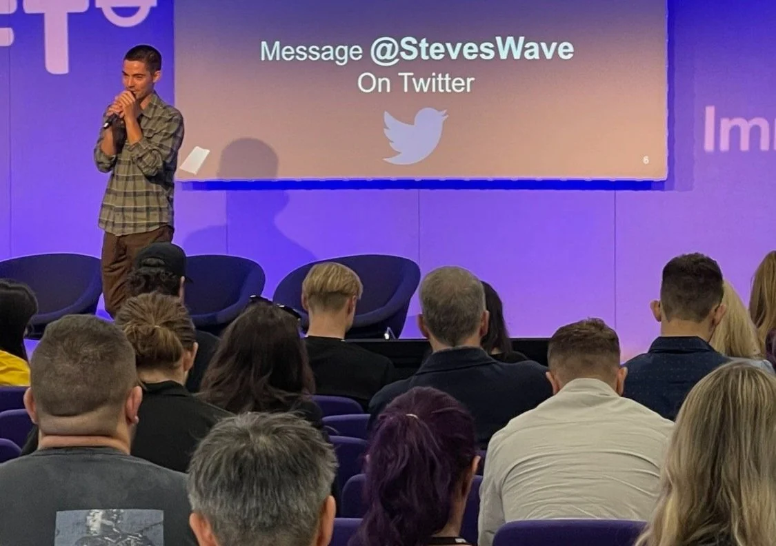 Steven Luis Howell speaking to an audience at NFT London in 2022